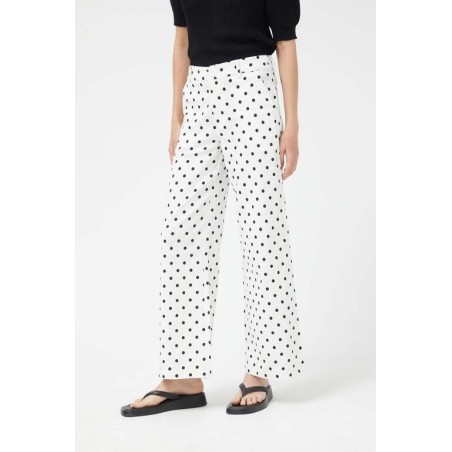 PANTALÓN VAQUERO RECTOS LUNARES BLANCO.