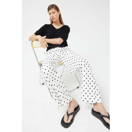 PANTALÓN VAQUERO RECTOS LUNARES BLANCO.