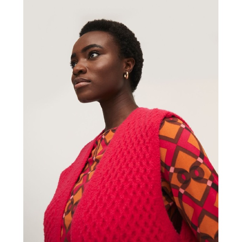 Chaleco de punto con estructura ochos.